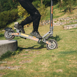 KuKirin G2 VMP rider crossing an obstacle outdoors