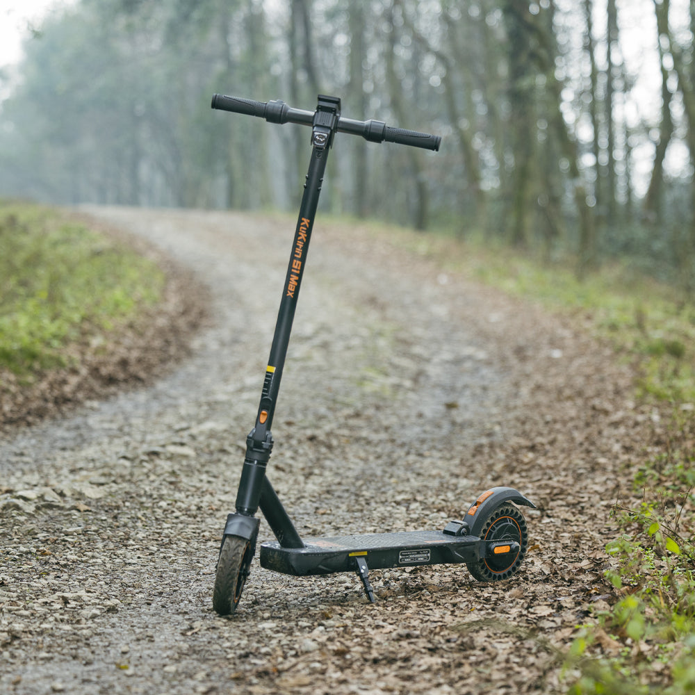 KuKirin S1 Max electric scooter parked on a forest path
